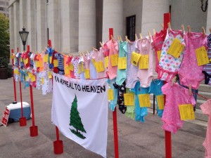70 "Onesies" representing 70 babies aborted in Ohio every business day.
