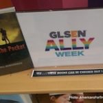 A book and glsen ally week card on the table
