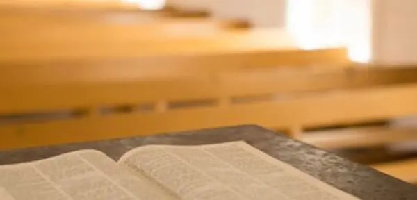 A close up of an open book on top of a table.