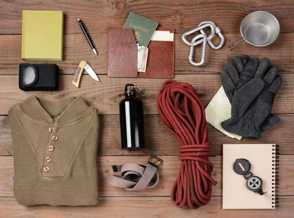 A wooden table topped with various items and tools.